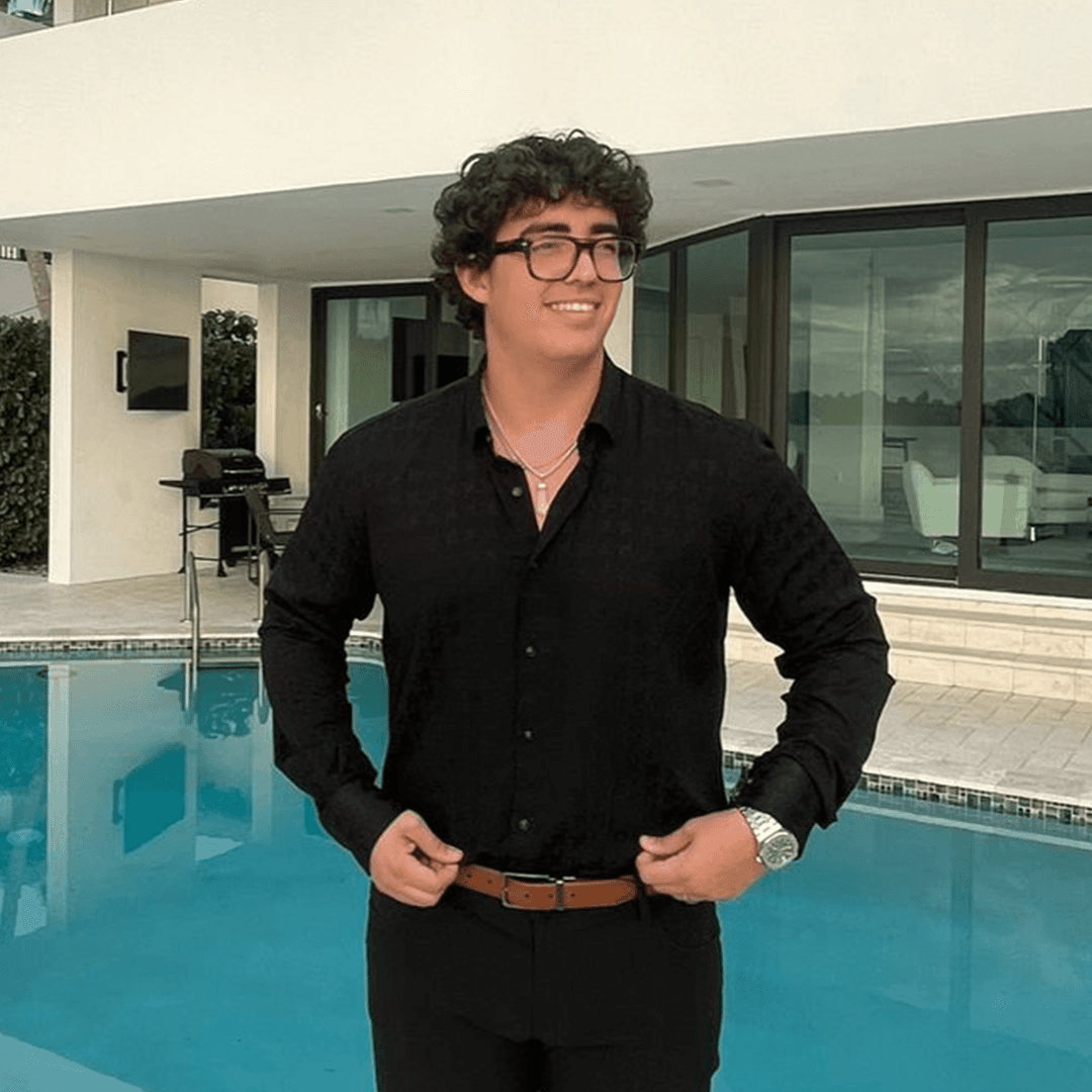 CEO of Blok Assets Juan Mari posted up infront of a pool with a watch and glasses.